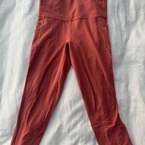Athleta Terracotta Salutation Stash Pocket Tight